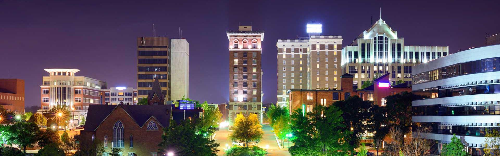 Neon color image of a band playing and people singing along